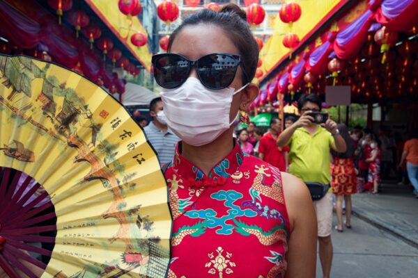 woman wearing mask during coronavirus in southeast asia